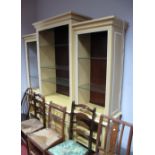 A Villeroy & Boch Painted Breakfront Bookcase, moulded cornice over open adjustable glass