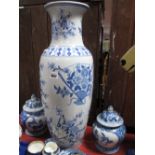 Two Blue and White China Jars and Covers; together with a blue and white floor vase, decorated