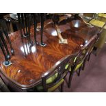 A Mahogany Oval Shaped Dining Table, on tapering legs, spade feet, (one extra leaf) and six shield