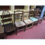 An Ercol Dark Elm Stick Back Dining Chair, a Country rush seated ladder back chair and three other