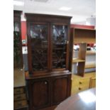 Late XX Century Book Cabinet With Dental Cornice, astral upper doors and paneled cupboard doors.