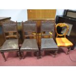 A Pair of Victorian Mahogany Balloon Back Dining Chairs, serpentine seats on ring turned tapering