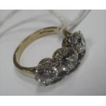 A 9ct Gold Large Three Stone Dress Ring, circular claw set throughout.