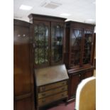 An Edwardian Mahogany Bureau Bookcase, top with glazed doors, two internal shelves, bureau with a