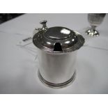 A Hallmarked Silver Mustard, of plain cylindrical form, with reeded hinged lid, scroll handle,