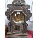 A Late XIX Century American Ansonia Mantel Clock, with shaped top, glazed door, with bead decoration