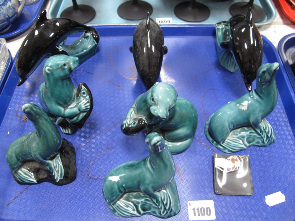 A Collection of Three Poole Pottery Small Dolphins, in turquoise and black glazes, two matching