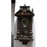 A Circa 1900 Mahogany 8 Day Wall Clock, broken pediment with mask head and half turned columns, over