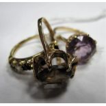 A 9ct Gold Single Stone Dress Ring, oval claw set; together with a circular single stone ring and