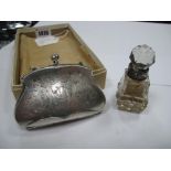 A Hallmarked Silver Ladies Purse, of shaped design allover engraved, on chain suspension with finger