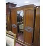 1920's Oak Wardrobe, with mirrored door, on bun feet.