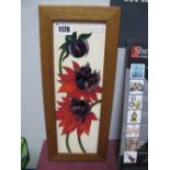 A Moorcroft Pottery Plaque, decorated with the Ruby Red design by Emma Bossons, 29 x 9.5cm, framed.