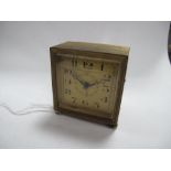 A Small Square Cased Bedside Clock, the signed dial "The Sheffield Goldsmiths Company Ltd Sheffield"