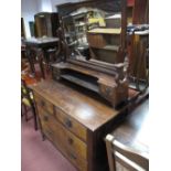 A XIX Century Walnut Dressing Table, with a centric mirror, two jewel drawers, two short and two