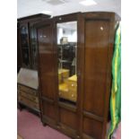 An Early XX Century Oak Three Piece Bedroom Suite, comprising wardrobe, dressing table and chest