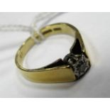 An 18ct Gold Single Stone Diamond Ring, the brilliant cut stone illusion set, between plain flat