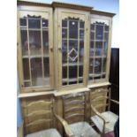 A Pine Breakfront Cabinet, dentil cornice over triple glazed doors, with interior shelving, each