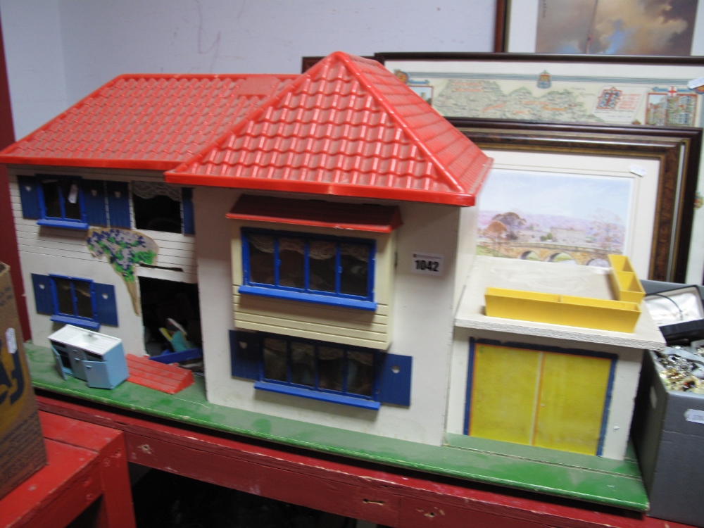 A Mid XX Century Dolls House, with a quantity of period furniture.