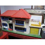 A Mid XX Century Dolls House, with a quantity of period furniture.