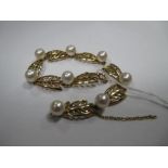 A Modern Pearl Set Bracelet, of stylised openwork leaf design, with uniform pearl highlights (