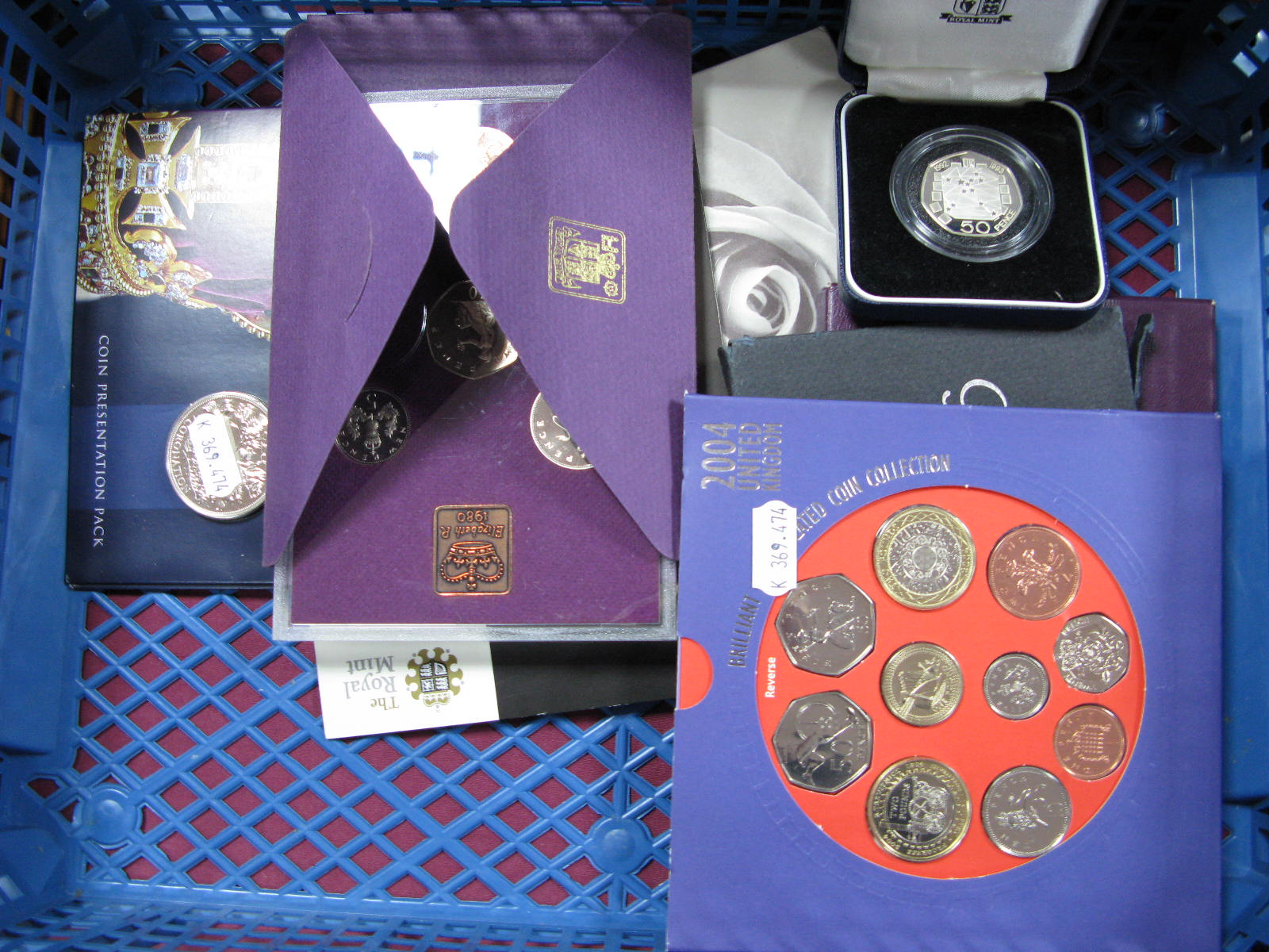 Four Royal Mint Coin Sets 1970, 1980, 1981, 2004 (BU), A Royal mint presentation pack Charles