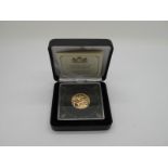 A 2013 United Kingdom Gold Sovereign, encapsulated, with certification.