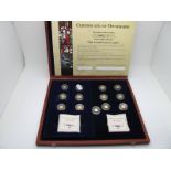 A Cased Windsor Mint "The Twelve Apostles in Gold", fourteen gold coins, certificates present.