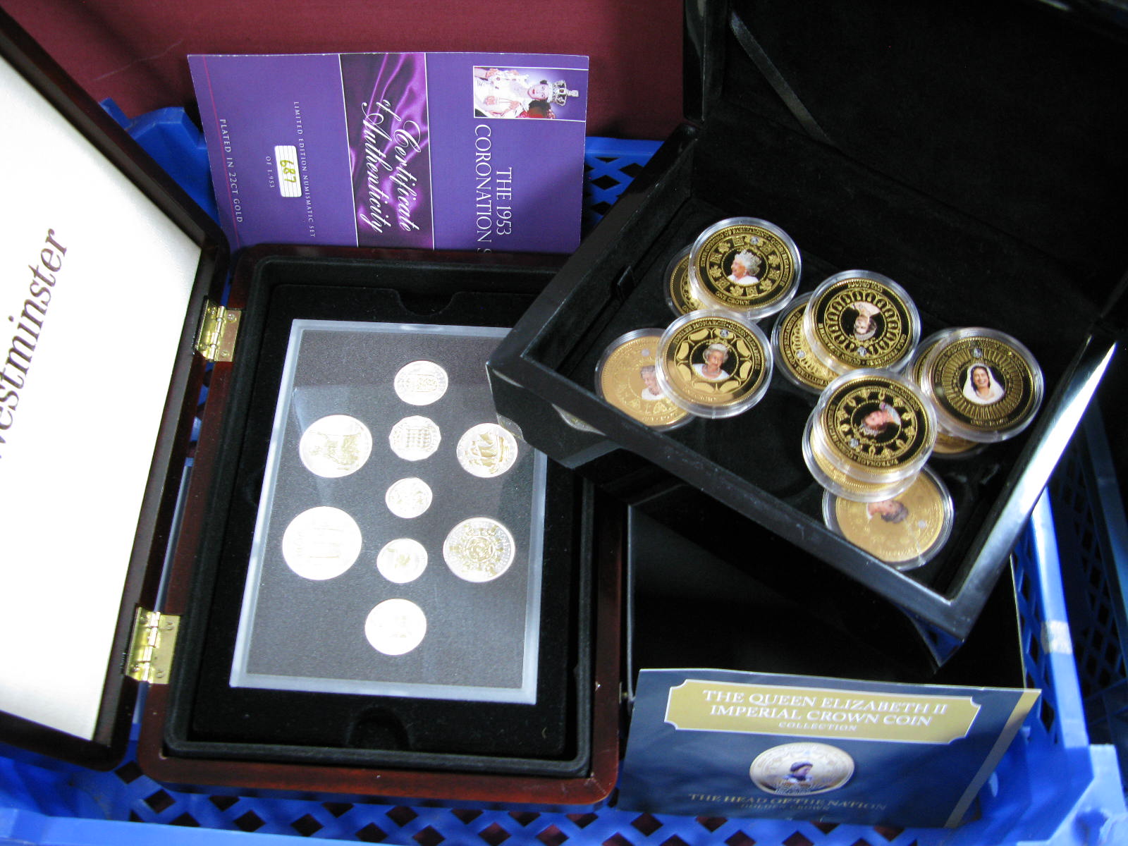 Twelve 2015 Tristan DA Cunia One Crown Coins, all British monarchy themes, presented in a