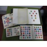 A Stamp Collection in Four Albums, G.B., Commonwealth and World mainly used. Noted G.B. Queen