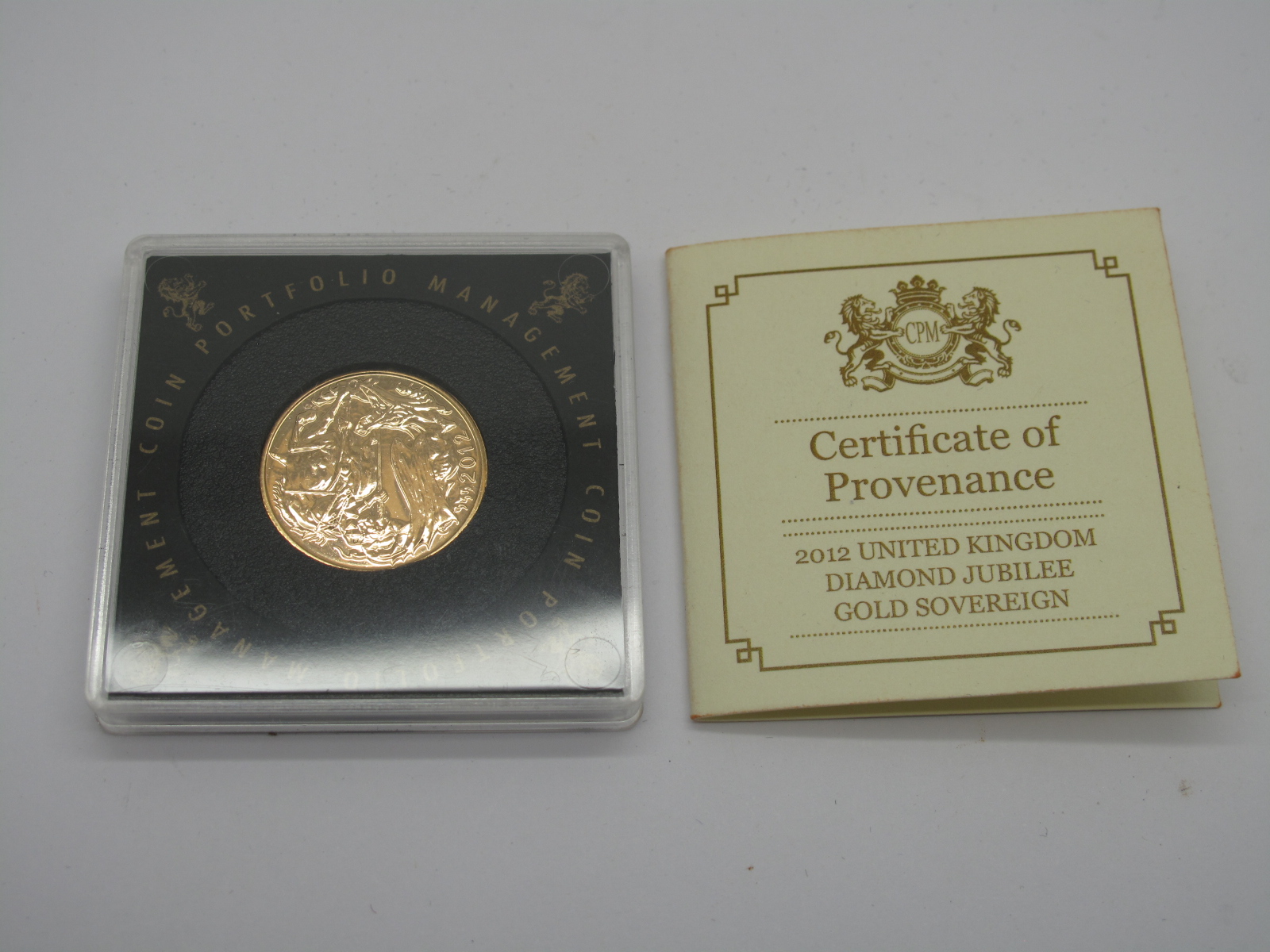 A 2012 Sovereign, Day's St George and Dragon reverse, encapsulated, certification present.