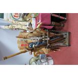 A Large Collection of Walking Sticks, Canes, Umbrellas, Shooting Stick etc. all contained in a