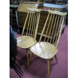 A Pair of Ercol Light Elm Dining Chairs, tapering spindle backs , shaped seats on 'H' stretchered