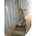 A Vintage Webb Petrol Driven Lawn Mower, fitted with rotary blades, roller and grass bucket and a