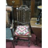 A XIX Century Carved Oak Hall Chair, with turned finial's, barley twist supports, carved seat, on