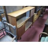 Teak Book Cabinet, with glass sliding doors, on tapering legs.