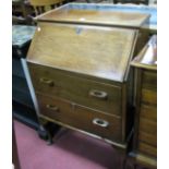 A Mid XX Century Walnut Bureau, with a fall front, fitted interior, two drawers, on cabriole legs,