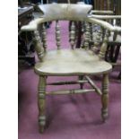 A XIX Century Ash and Elm Pad Arm Chair, with low bock, shaped arms, turned spindles, legs and