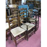 A XIX Century Elm Ladder Back Carver Chair, with rush seat; five similar chairs. (6)
