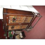 An Early XX Century Oak Display Cabinet, leaded and stained glass doors in the Art Nouveau style,