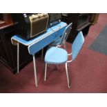 A Vintage Keron Ltd Drop Leaf Kitchen Table; together with a pair of chairs on tubular frames.