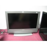 Sony LCD Colour TV 26" Flatscreen; together with remote and stand.