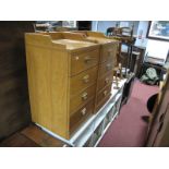 A Pair of Yew Effect Bedside Chests, each of four drawers having low gallery back. (2)