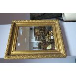 An Early XX Century Rectangular Bevelled Wall Mirror, in gilt wood frame.