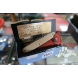 An Early XX Century Ebony (Stamp) Box, hinged lid, a win blade pen knife with ivorine scales, a