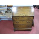 A Mid XX Century Oak Bureau, with a fall front, fitted interior, three long drawers on bracket