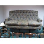 A Mckinney Floral Button Back, upholstered three seater settee.