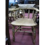 A XIX Century Ash and Elm Pad Arm Chair, with low back, shaped arms, turned spindles, legs and