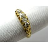 An 18ct Gold Five Stone Diamond Ring, the graduated old cut stones claw set.