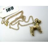 A 9ct Gold Novelty Poodle Charm Pendant, on a 9ct gold chain.