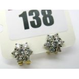 A Pair of Diamond Cluster Earrings, each of flowerhead design, claw set throughout with brilliant